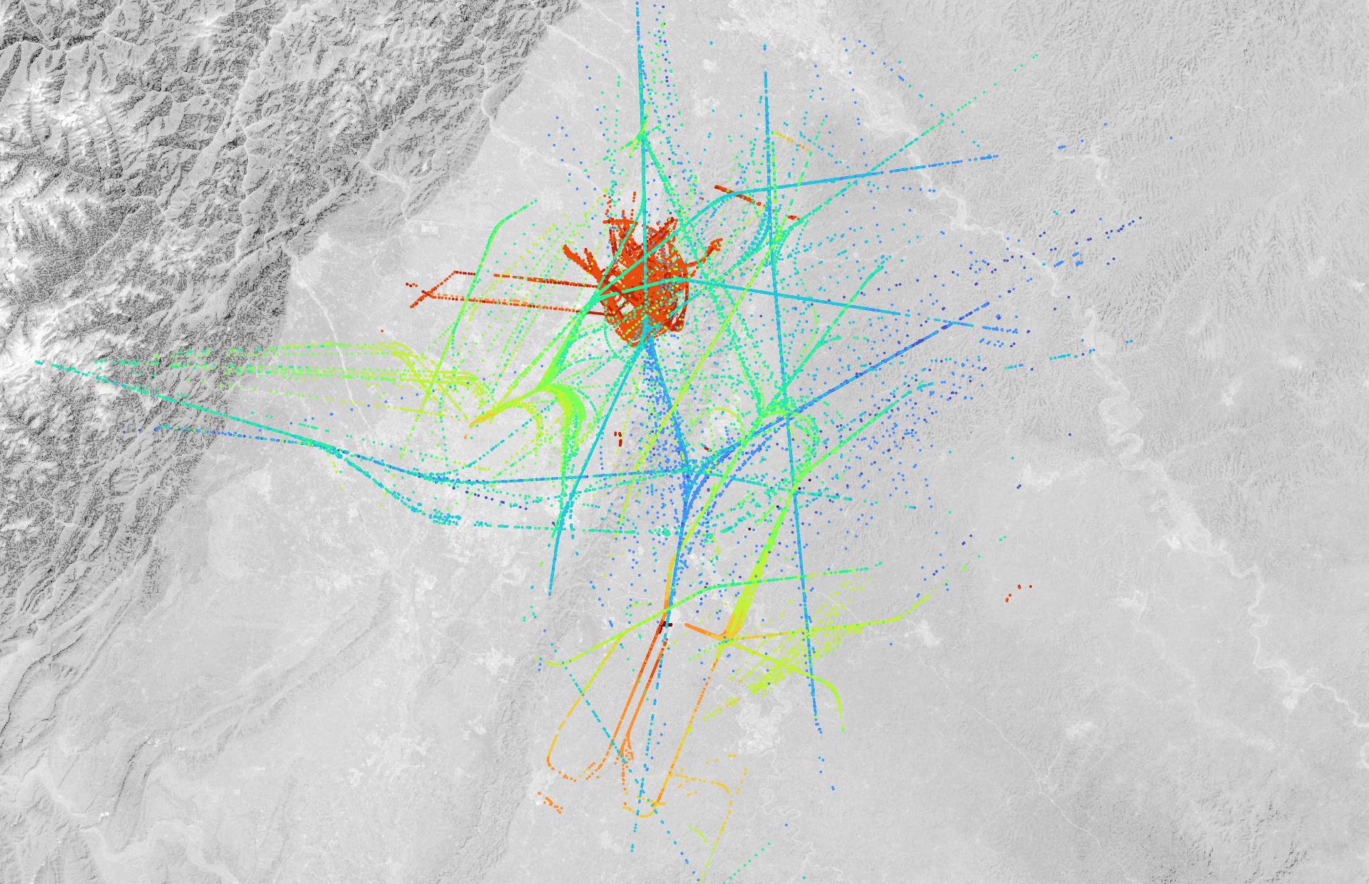 colored dots plotted over a greyscale terrain map